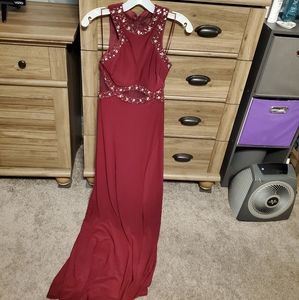 A burgendy prom dress with sequence